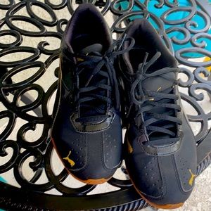 Black and gold pumas size 8.5